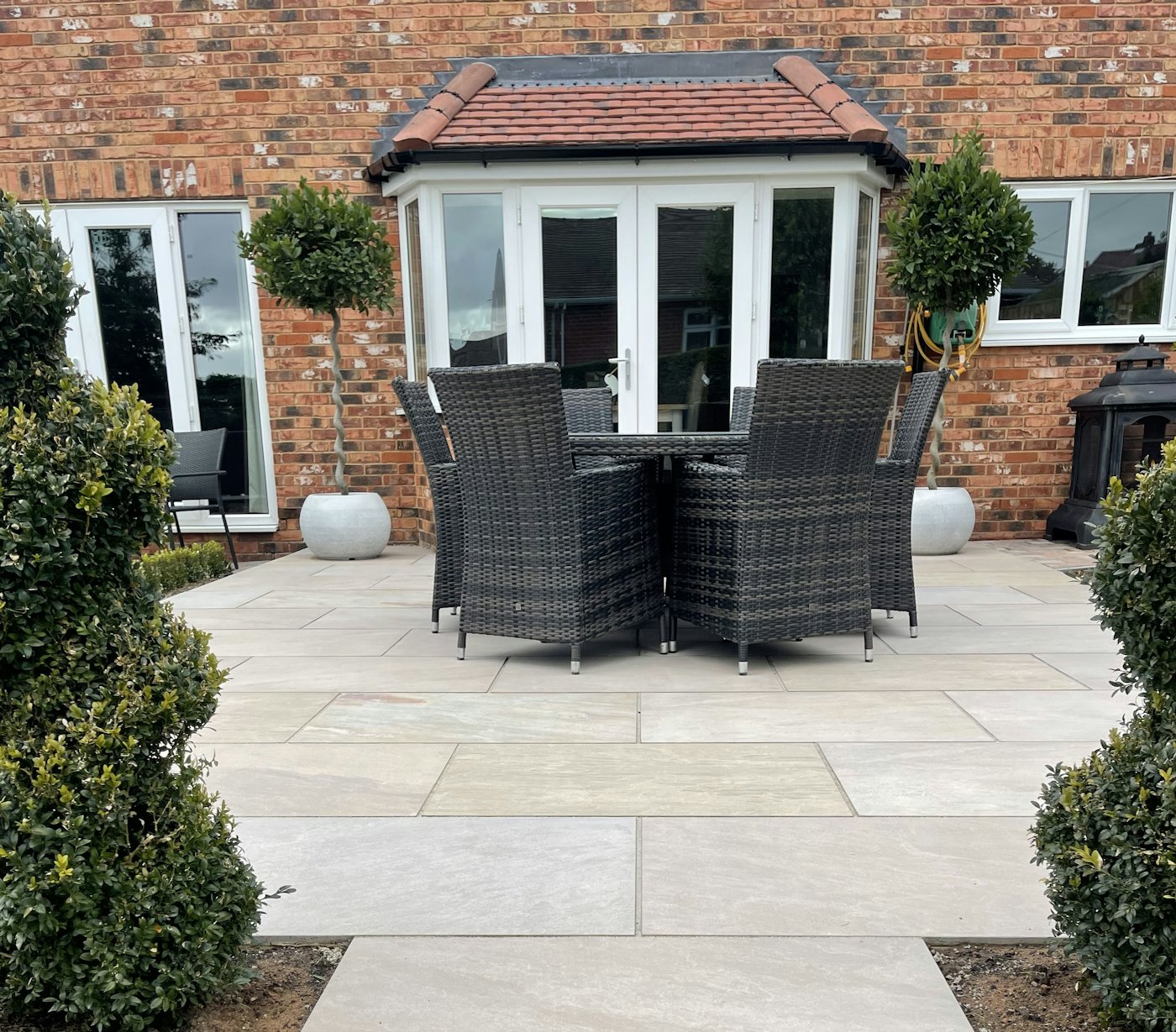 Paved courtyard patio with seating