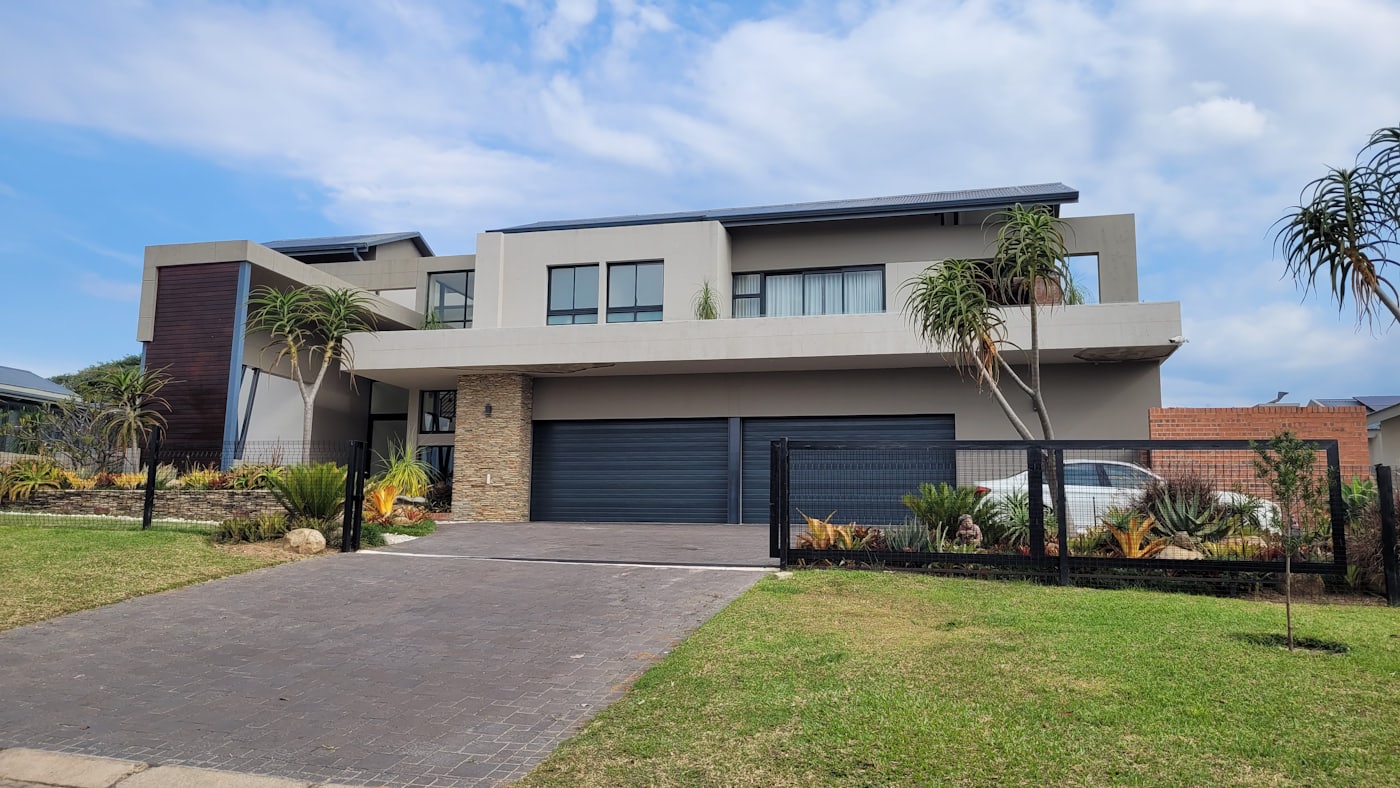 Driveway with adjacent lawn at a detached home