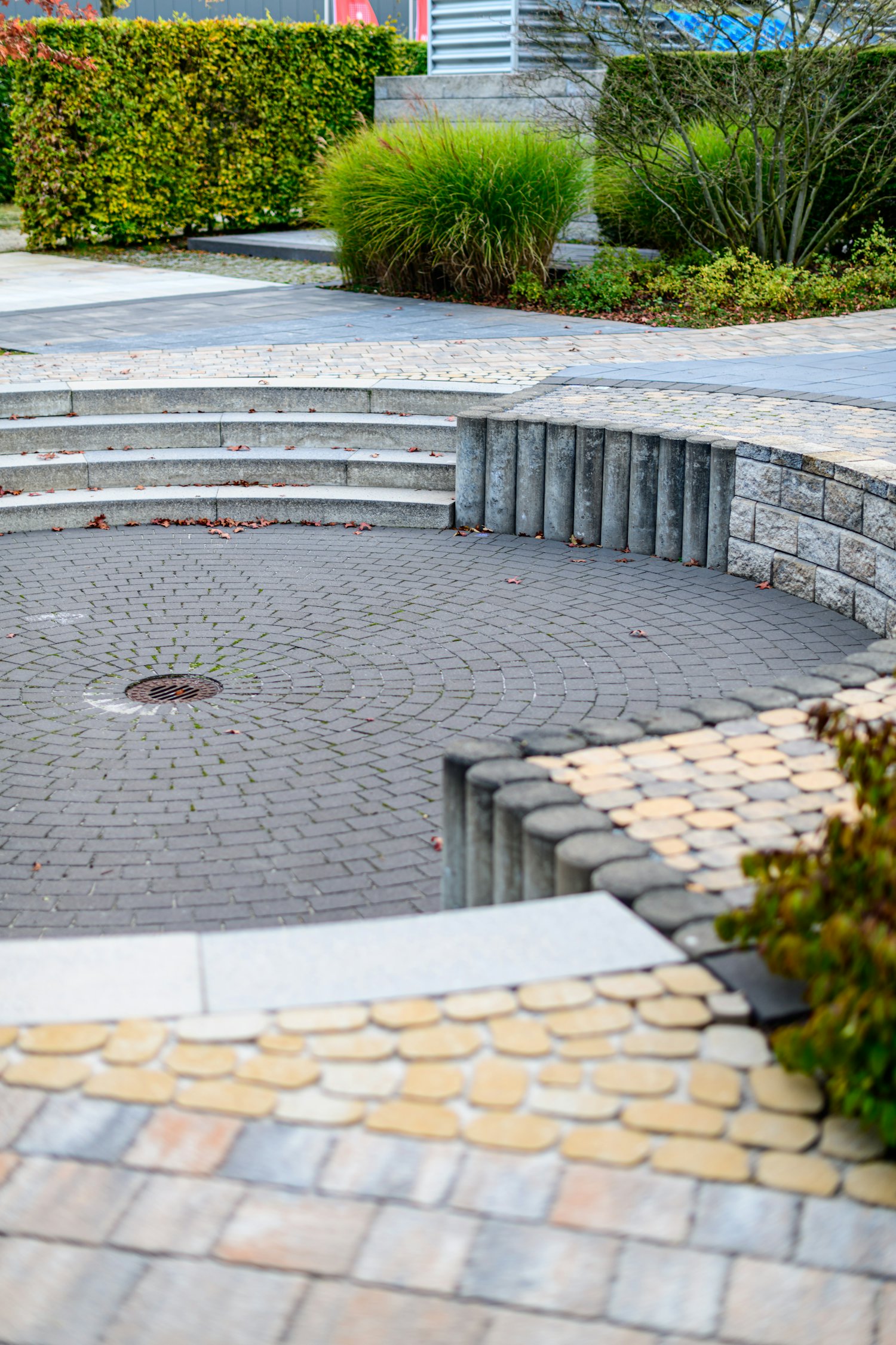Landscaped patio with block paving, granite steps and planting